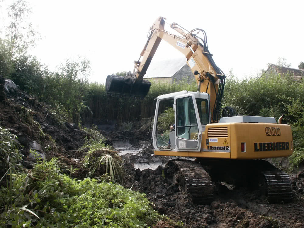 JCB digging drainage trench